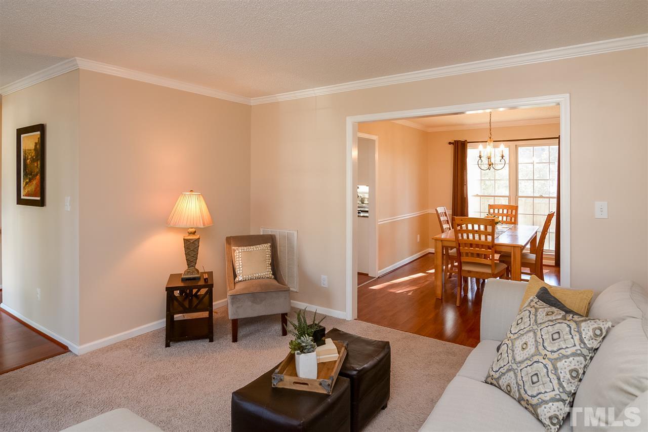 4404 Labrador Drive Raleigh, NC 27616 - Photo 6 of 25 a living room with furniture and a wooden floor