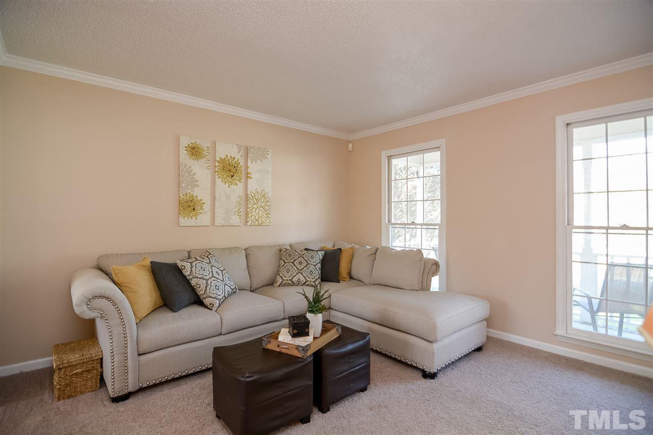 4404 Labrador Drive Raleigh, NC 27616 - Photo 7 of 25 a living room with furniture and a window
