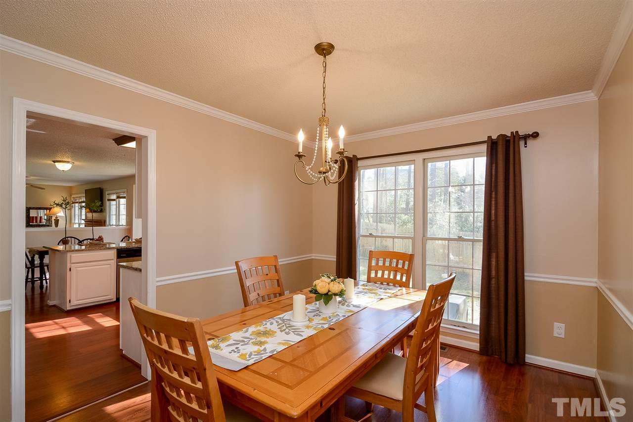 4404 Labrador Drive Raleigh, NC 27616 - Photo 8 of 25 a view of a dining room with furniture window and wooden floor