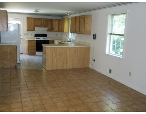 18 Blodgett Road Holland, MA 01521 - Photo 3 of 13 a kitchen with stainless steel appliances granite countertop a stove a sink and a refrigerator