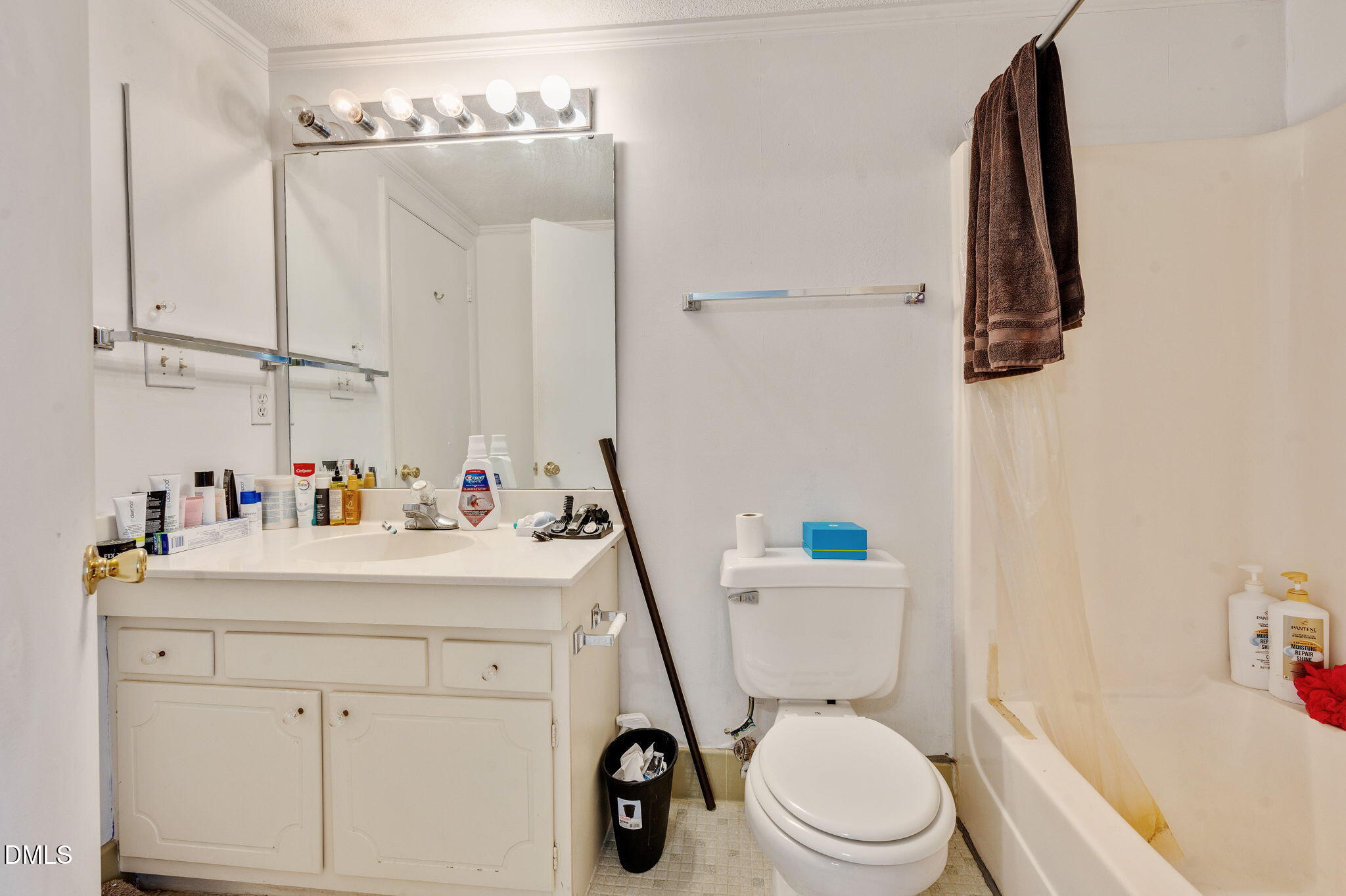 4603 Edwards Mill Road Raleigh, NC 27612 - Photo 17 of 26 a bathroom with a sink a toilet and vanity
