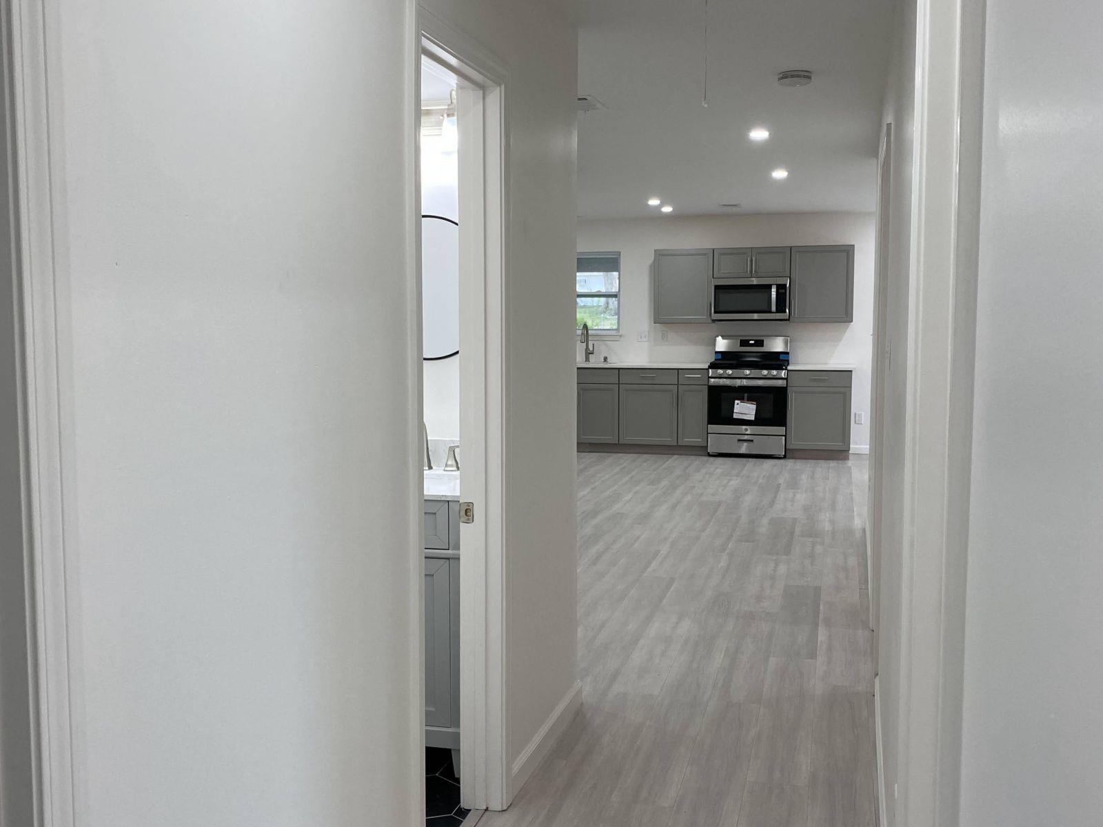 5089 Horn Lake Road Memphis, TN 38109 - Photo 18 of 23 a view of kitchen with wooden floor and electronic appliances