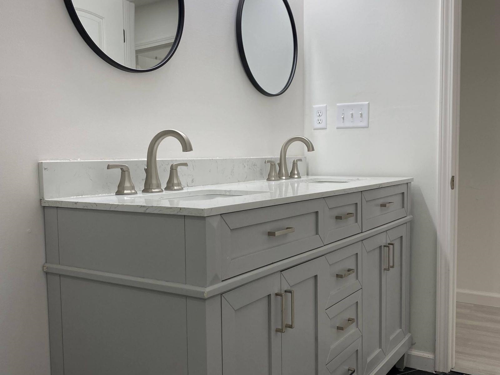 5089 Horn Lake Road Memphis, TN 38109 - Photo 19 of 23 a bathroom with a sink and a mirror