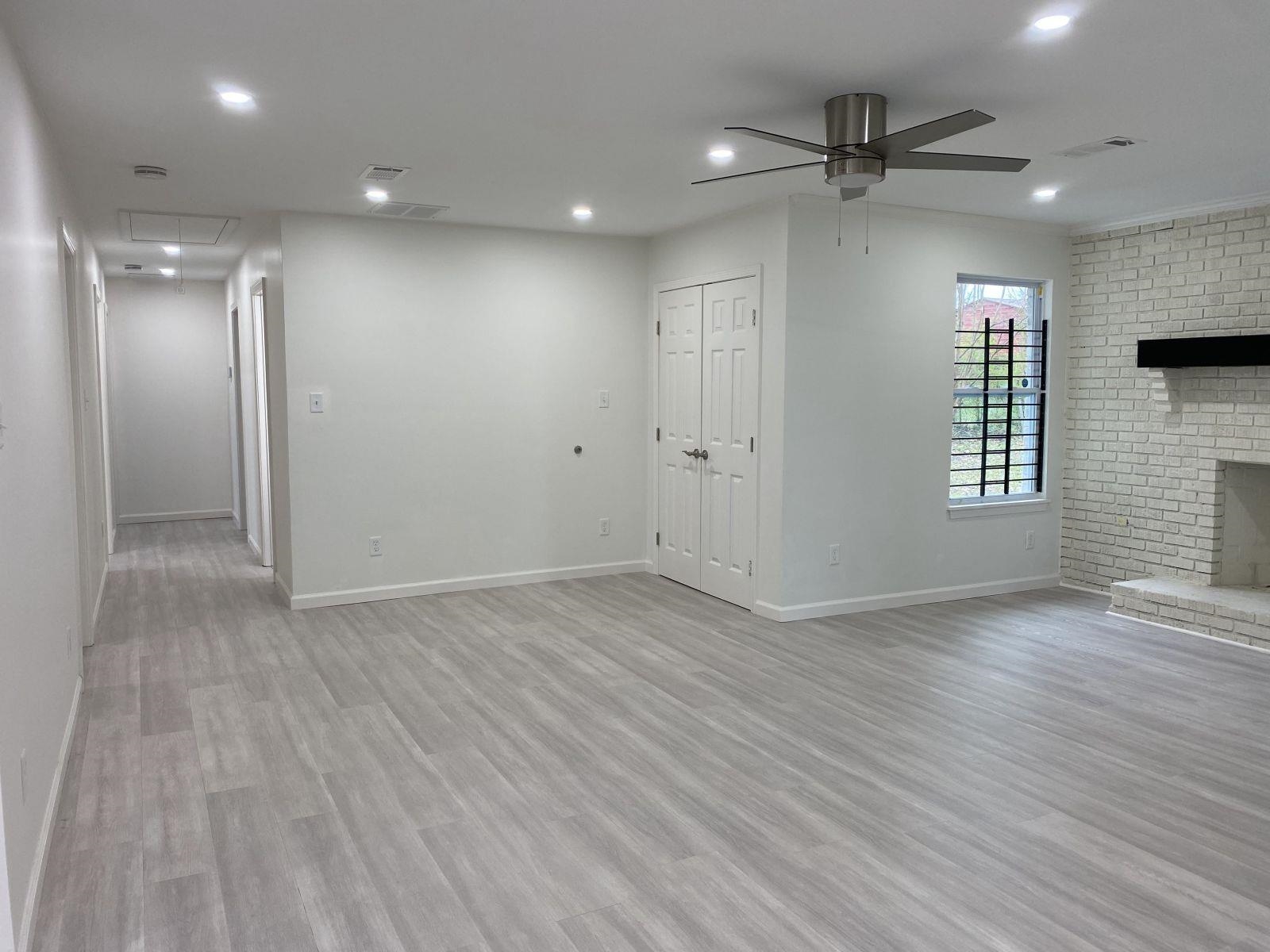 5089 Horn Lake Road Memphis, TN 38109 - Photo 20 of 23 wooden floor in an empty room with a window