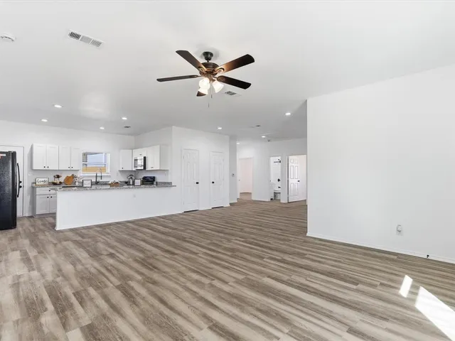 a view of kitchen with wooden floor