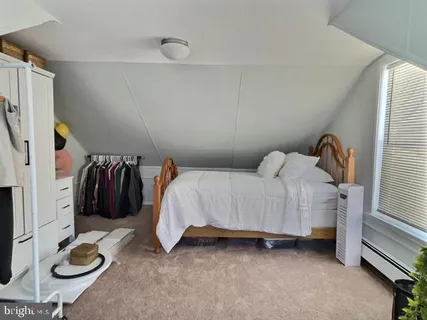 a bedroom with a bed and cabinets