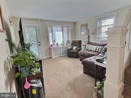 a living room with furniture and a couch