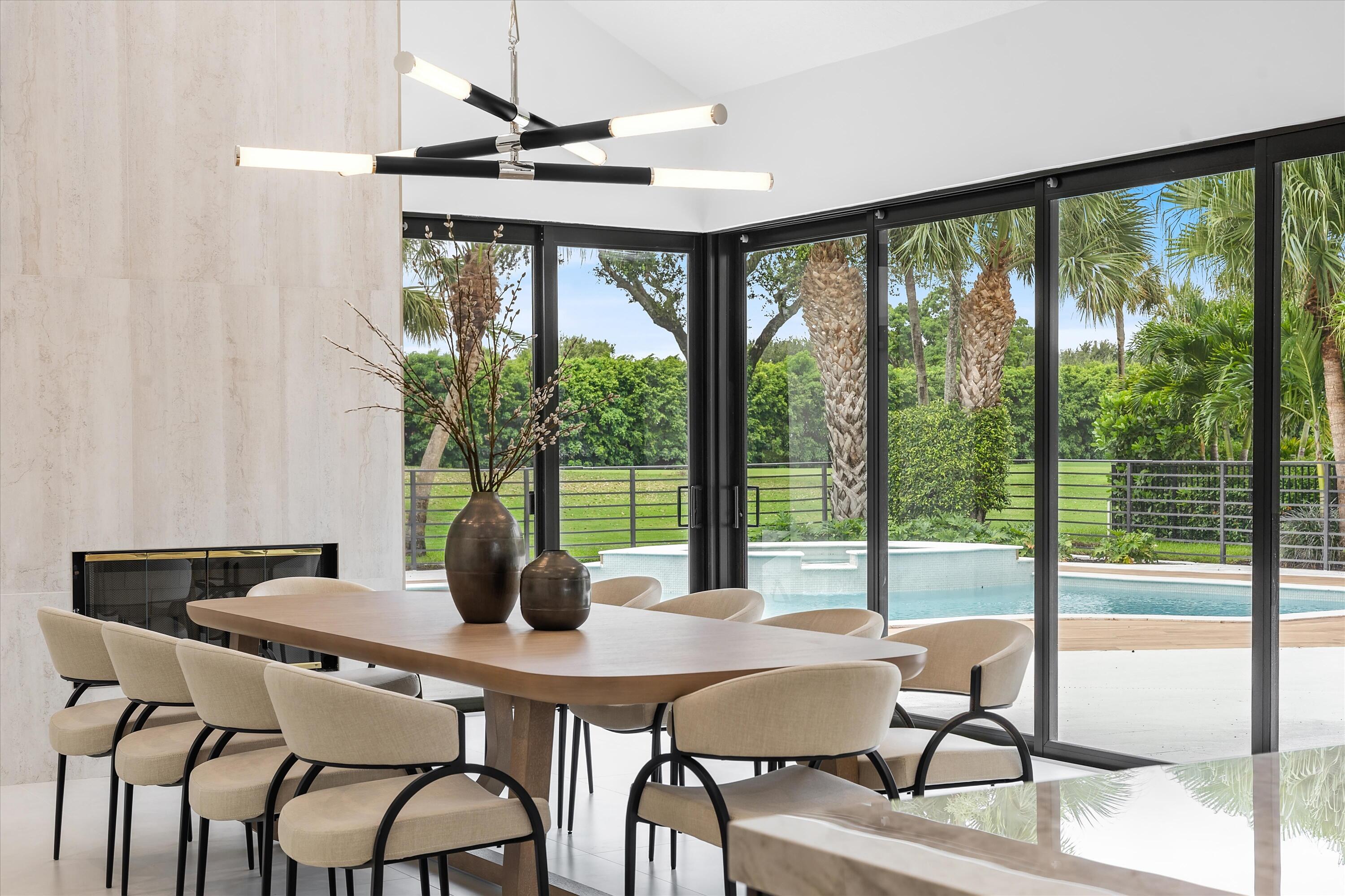 4816 Bocaire Boulevard Boca Raton, FL 33487 - Photo 25 of 61 a view of a dining room with furniture window and outside view