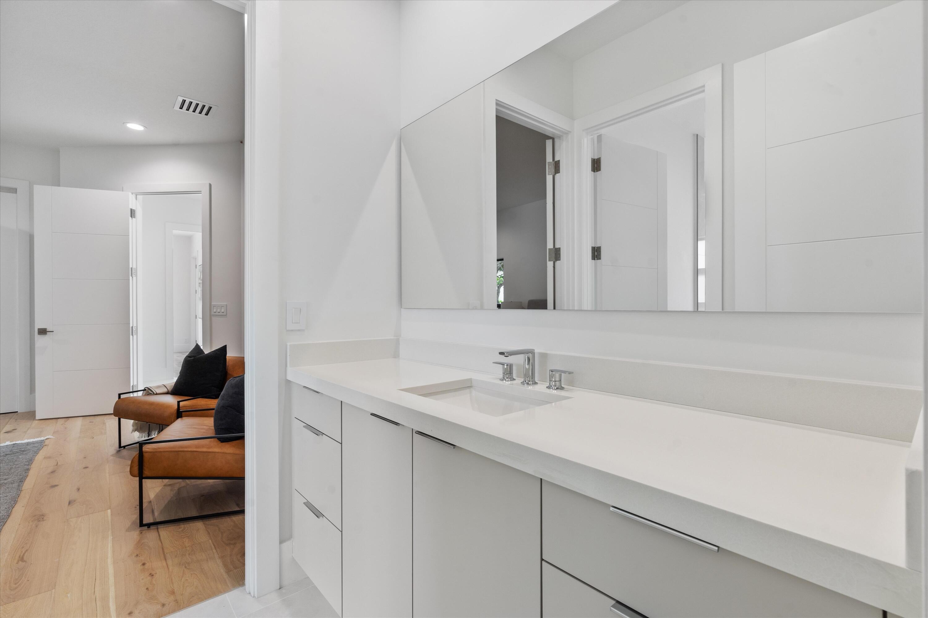 4816 Bocaire Boulevard Boca Raton, FL 33487 - Photo 35 of 61 a bathroom with a sink and a mirror