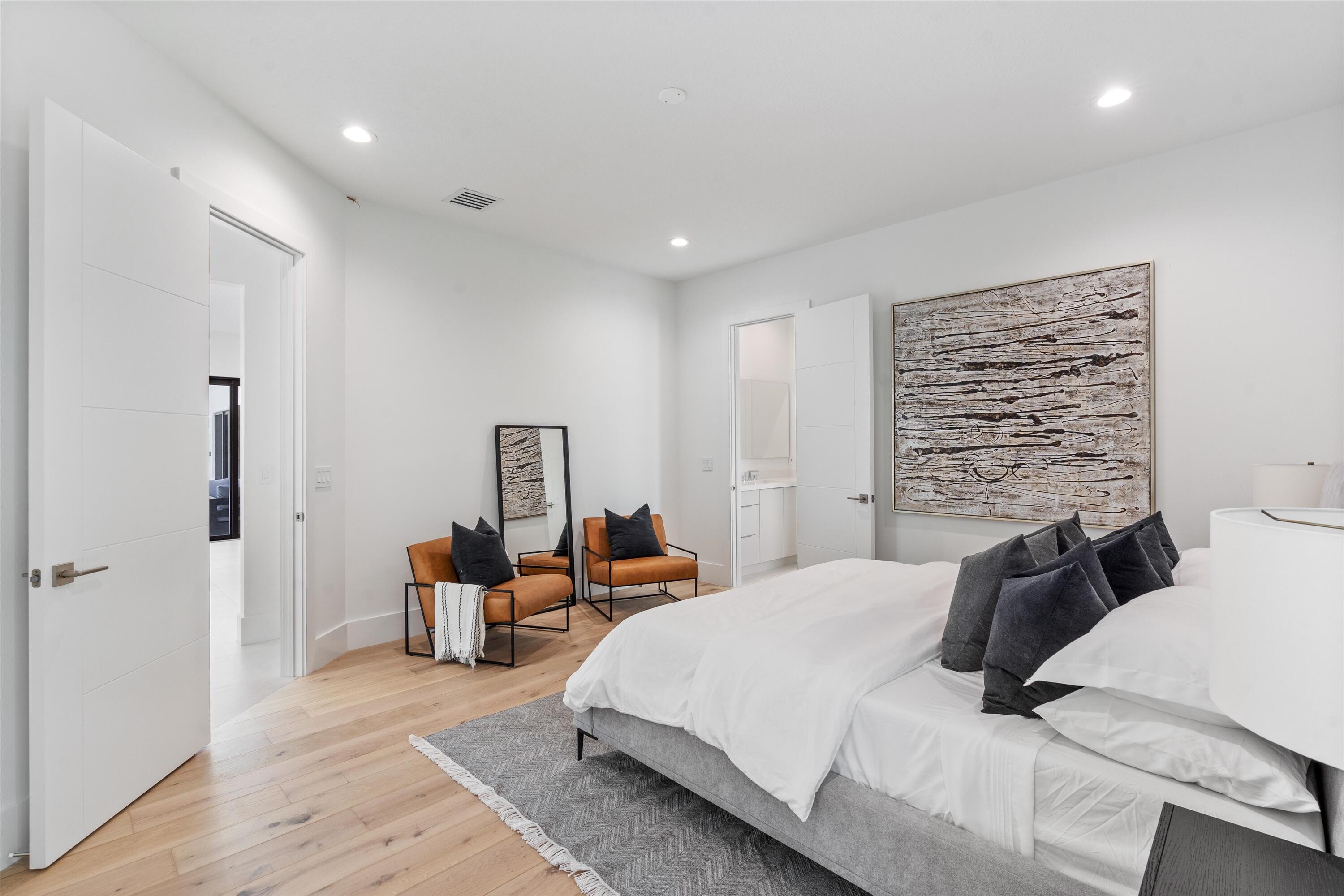 4816 Bocaire Boulevard Boca Raton, FL 33487 - Photo 37 of 61 a bedroom with a bed and wooden floor