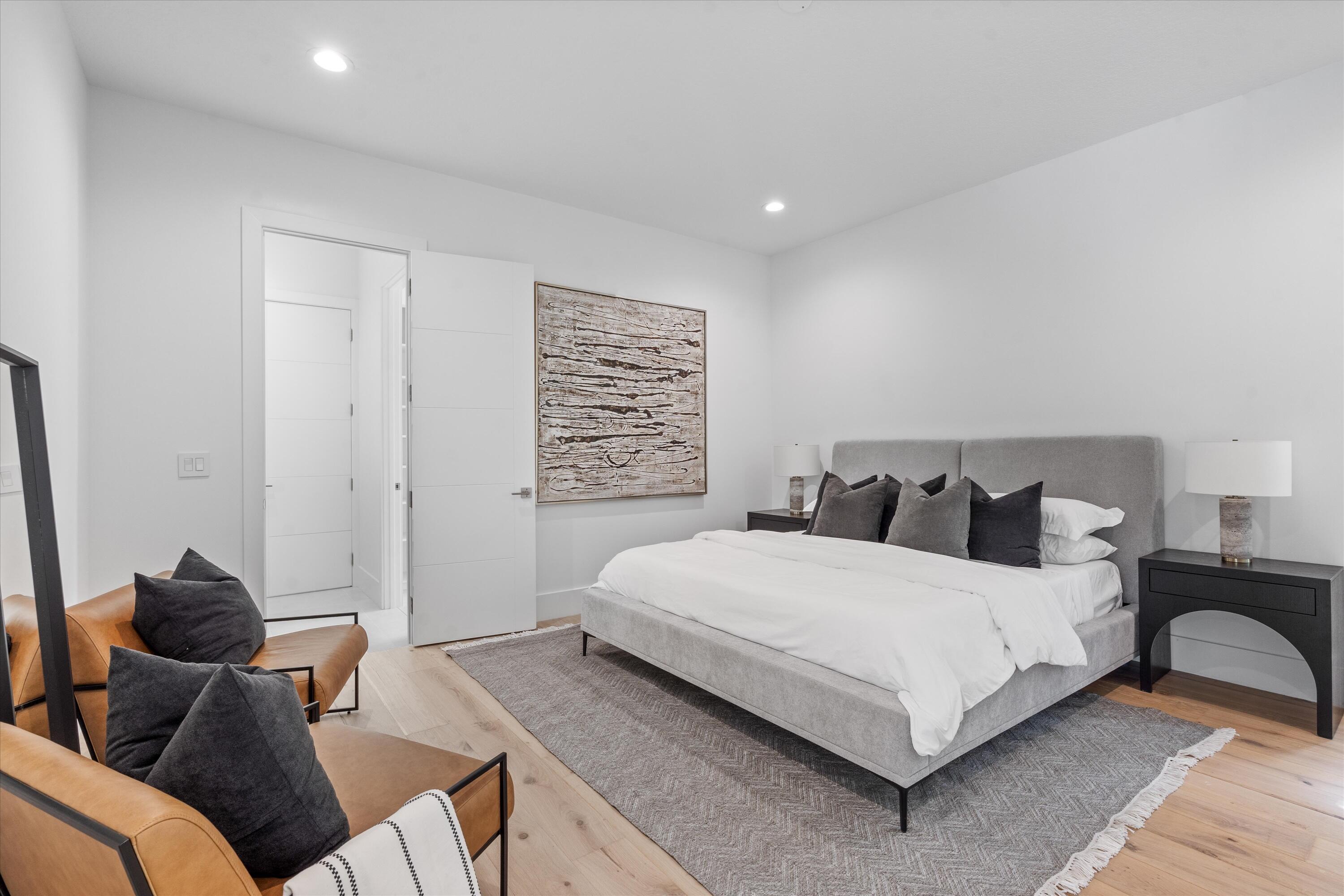 4816 Bocaire Boulevard Boca Raton, FL 33487 - Photo 38 of 61 a bedroom with a bed and a couch