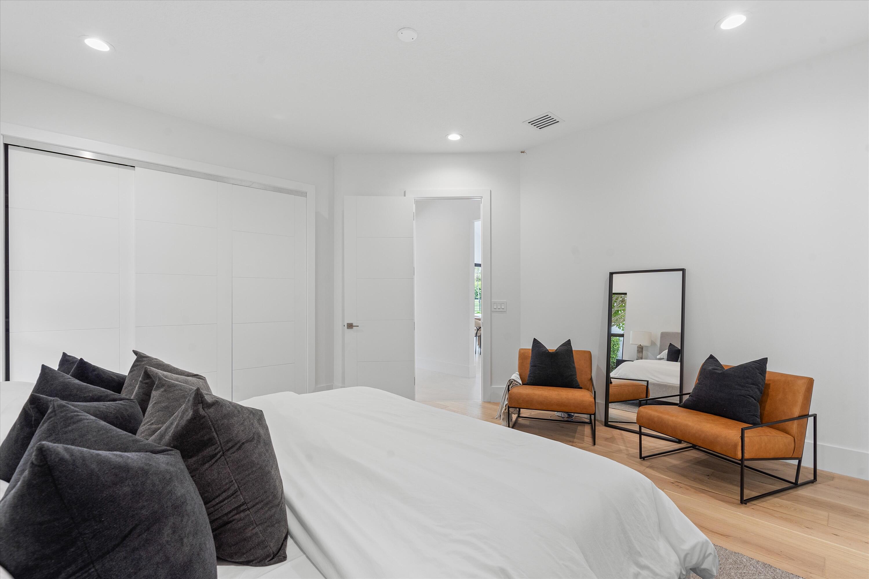 4816 Bocaire Boulevard Boca Raton, FL 33487 - Photo 39 of 61 a bedroom with a bed and a couch