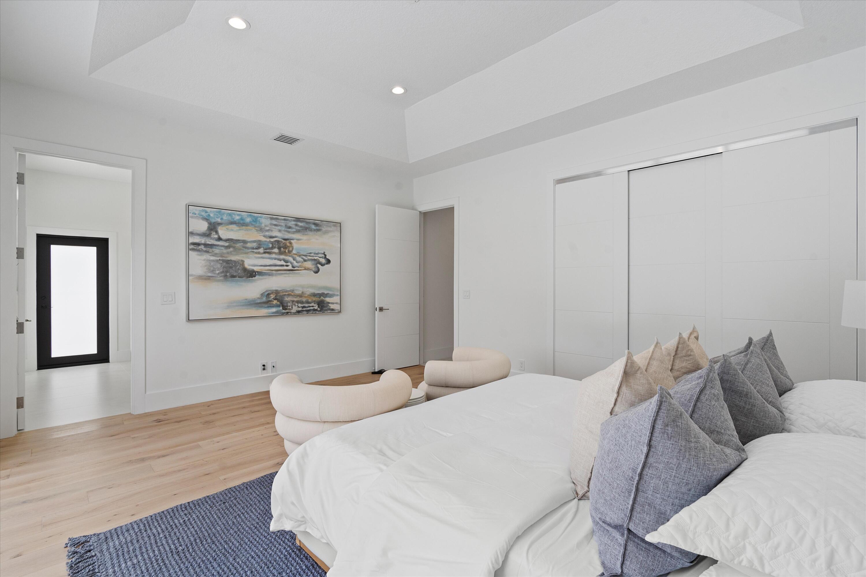 4816 Bocaire Boulevard Boca Raton, FL 33487 - Photo 43 of 61 a bedroom with a bed and a couch