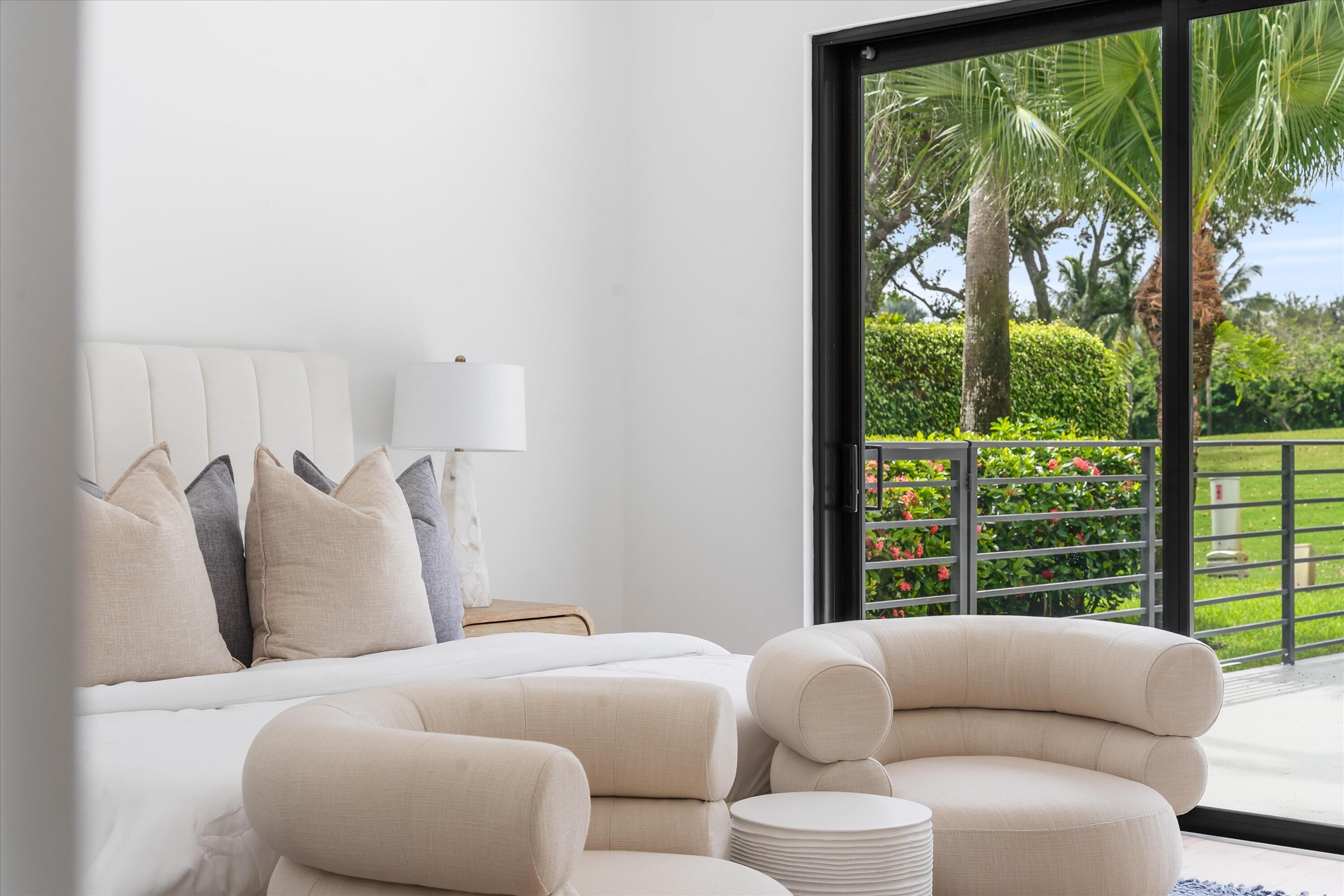 4816 Bocaire Boulevard Boca Raton, FL 33487 - Photo 44 of 61 a living room with furniture and a large window
