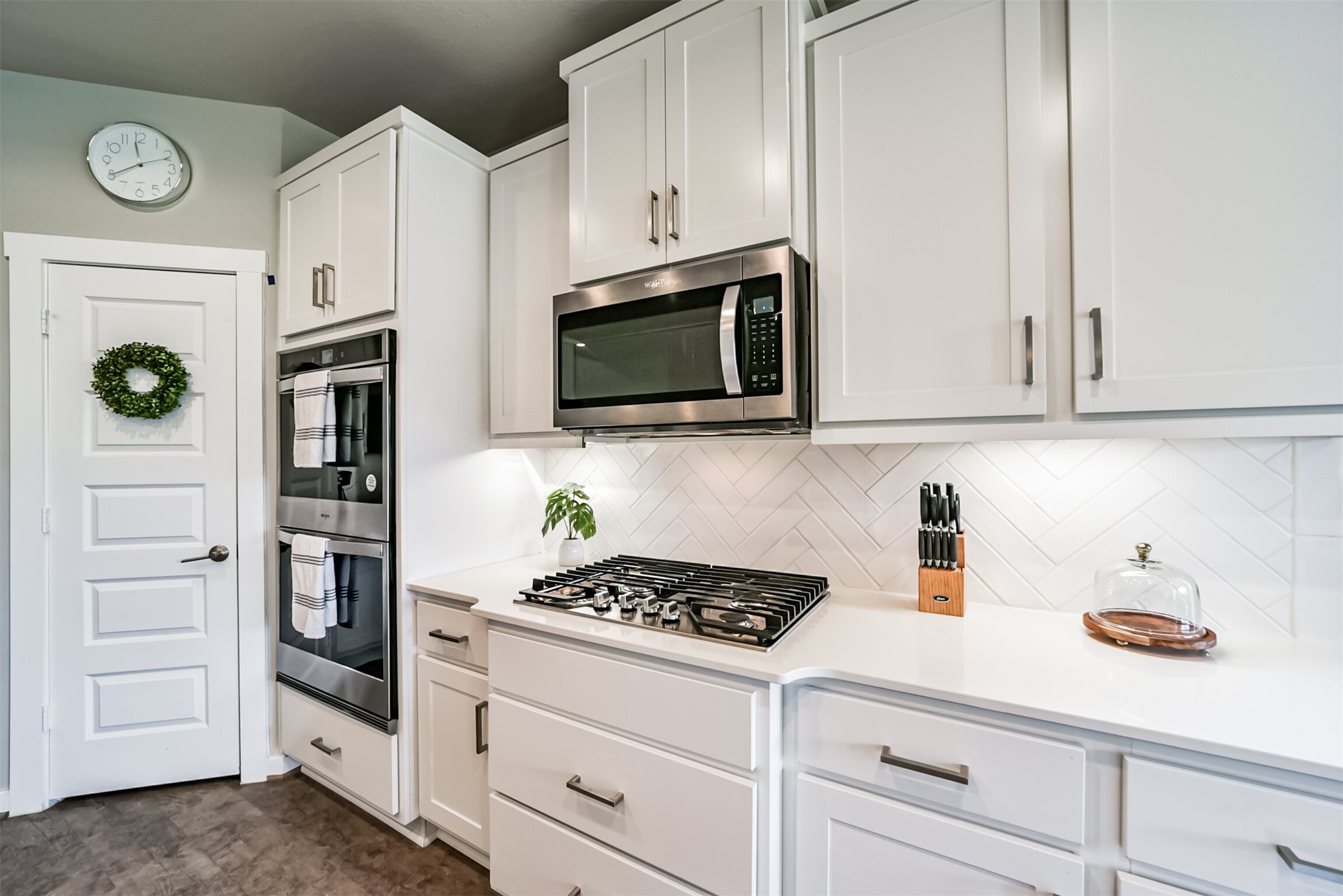 29510 Red Rocks Pk Drive Katy, TX 77494 - Photo 11 of 31 a kitchen with stainless steel appliances white cabinets and a stove a oven with white countertops