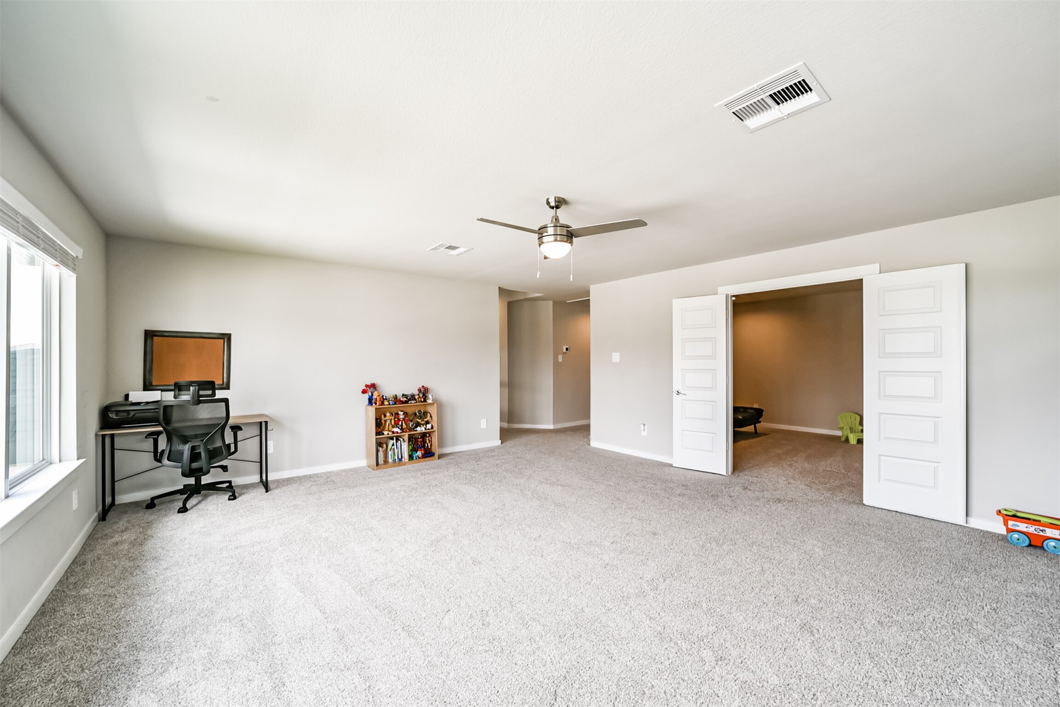 29510 Red Rocks Pk Drive Katy, TX 77494 - Photo 21 of 31 a view of a livingroom with workspace and a window