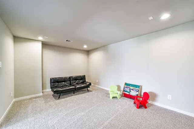 an empty room with window and wooden floor