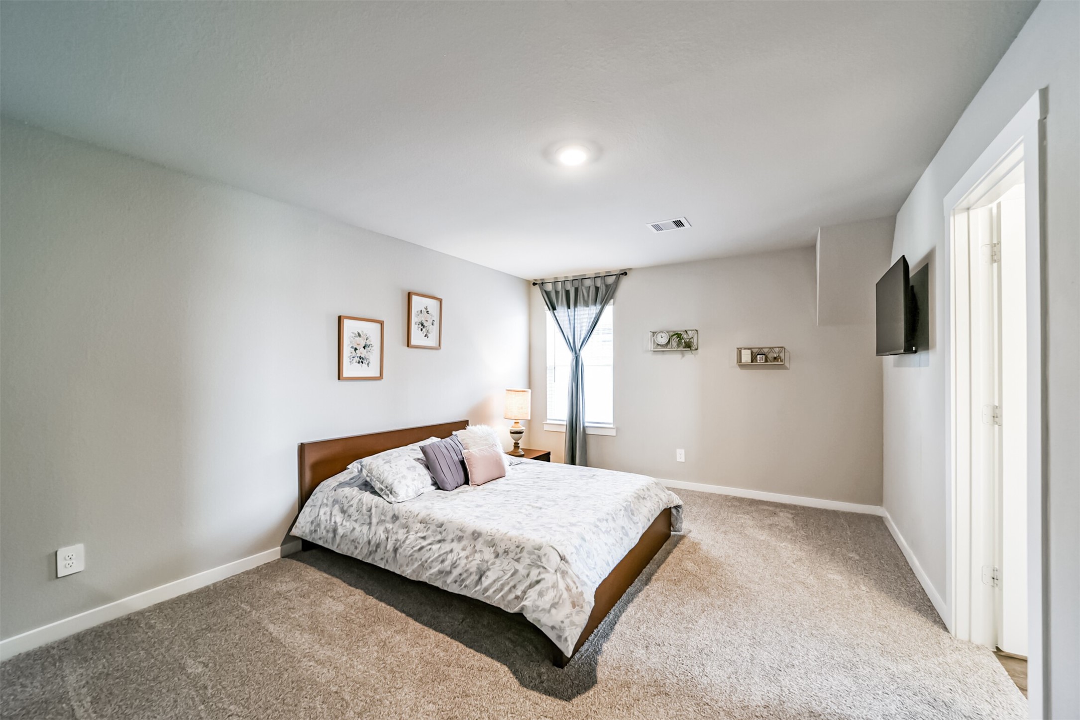 29510 Red Rocks Pk Drive Katy, TX 77494 - Photo 24 of 31 a bedroom with a large bed and a window