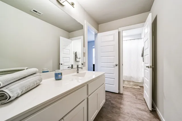 a view of a patio with table and chairs and potted plants