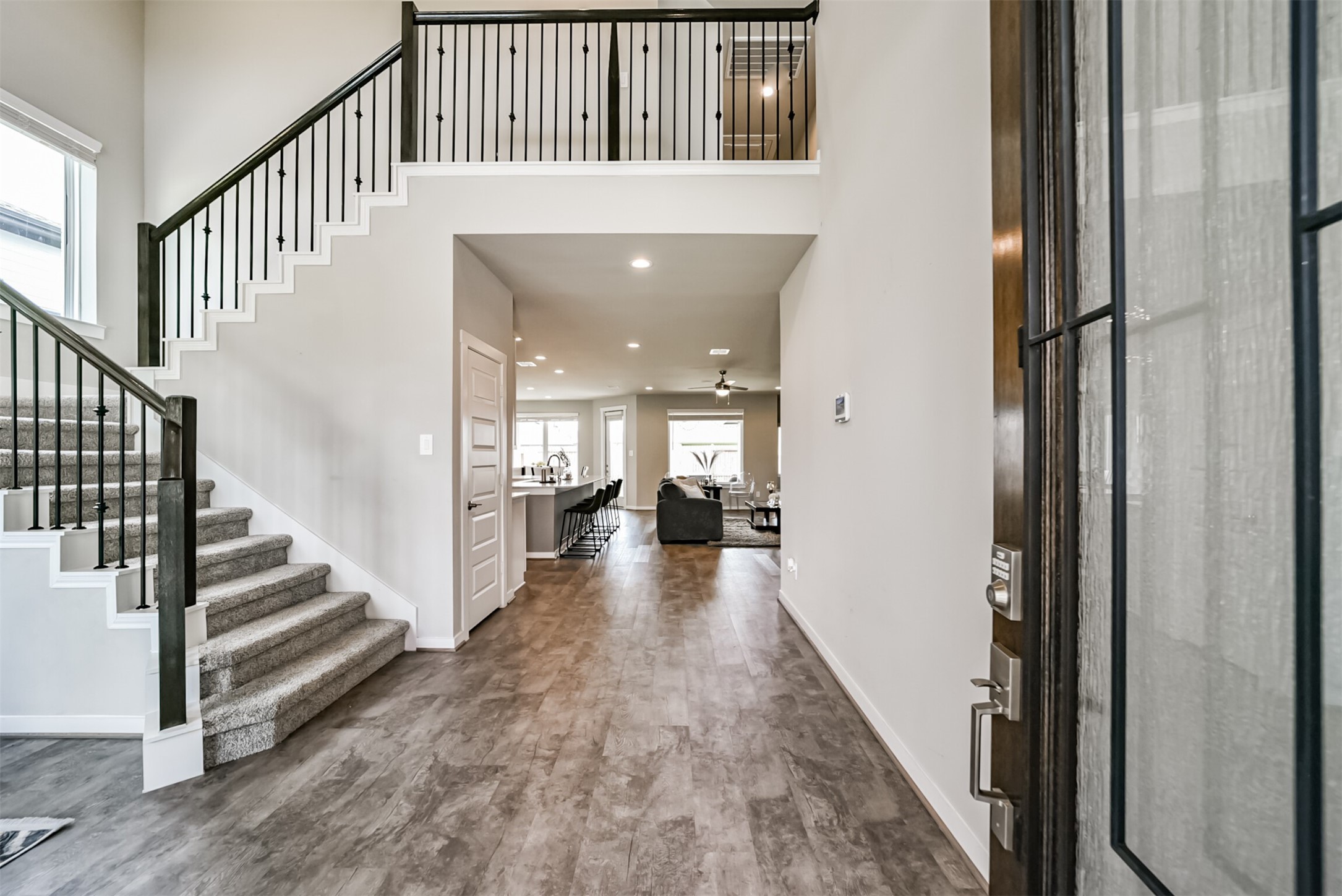 29510 Red Rocks Pk Drive Katy, TX 77494 - Photo 3 of 31 a view of a hallway with wooden floor and staircase
