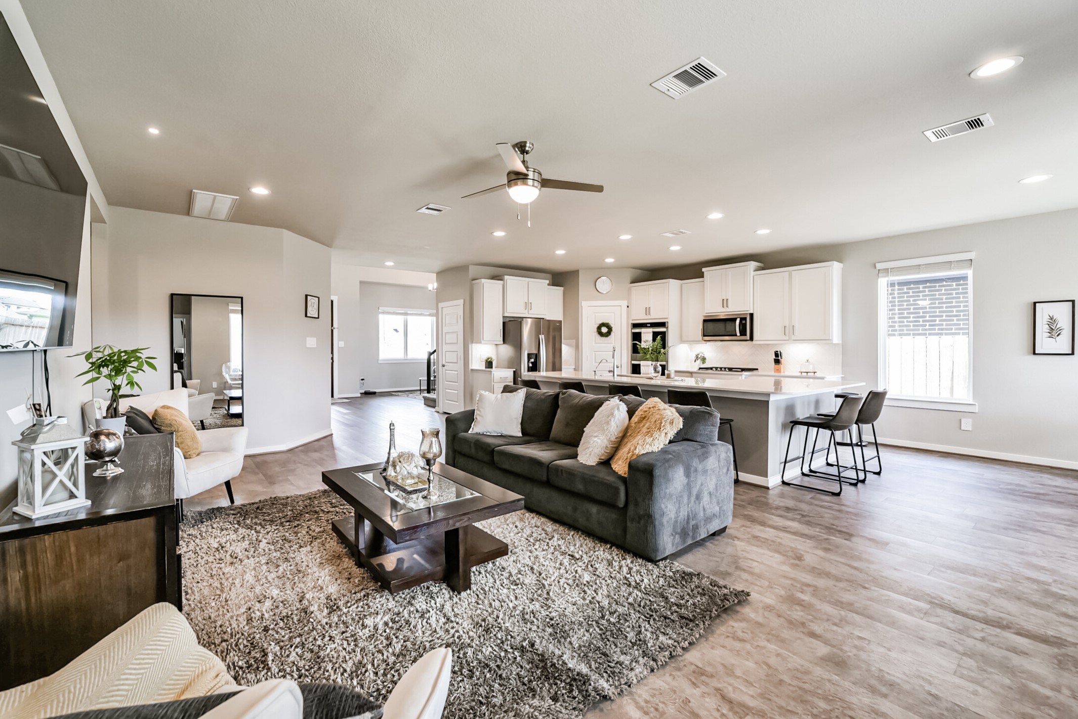29510 Red Rocks Pk Drive Katy, TX 77494 - Photo 8 of 31 a living room with furniture kitchen view and a wooden floor
