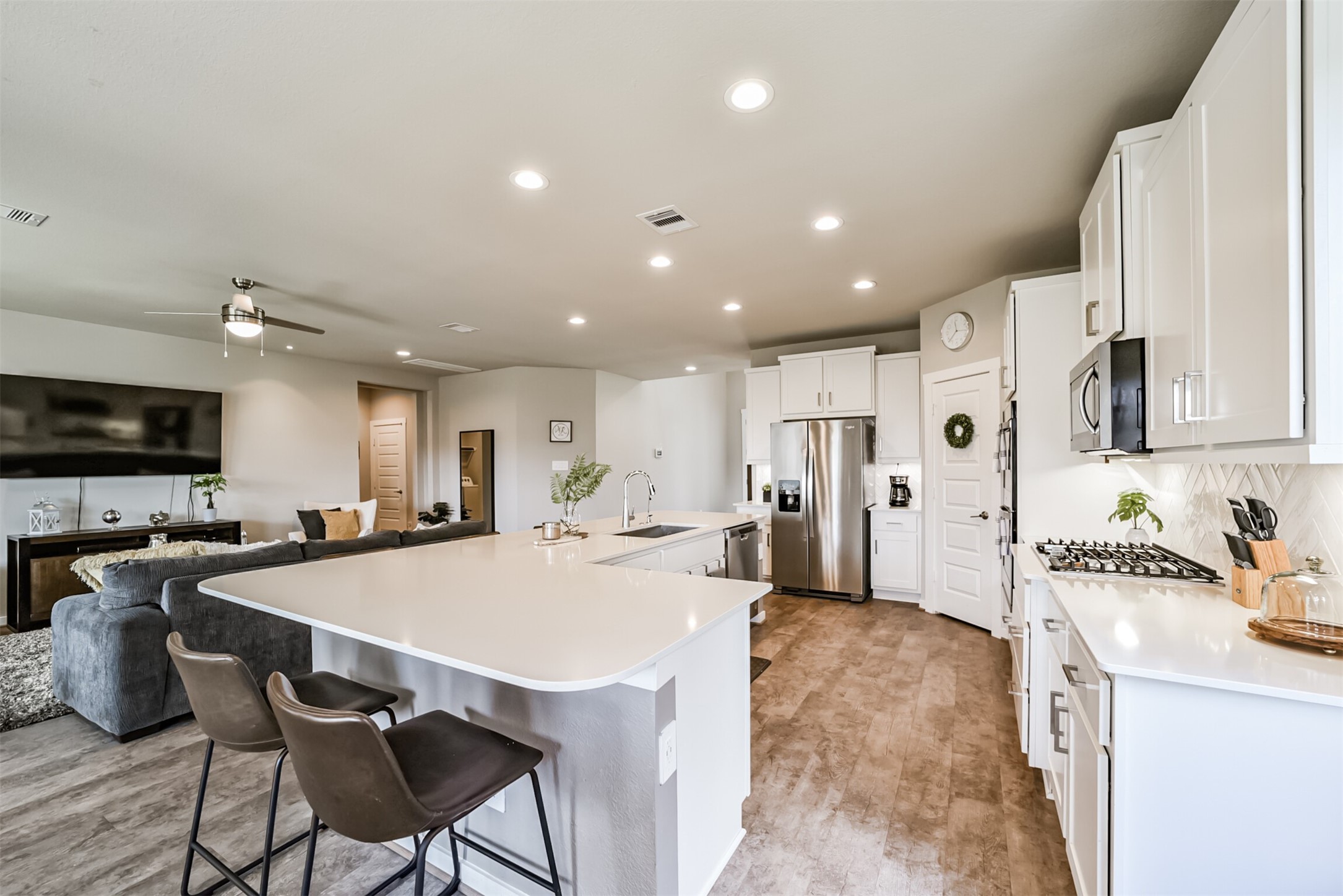 29510 Red Rocks Pk Drive Katy, TX 77494 - Photo 9 of 31 a kitchen with stainless steel appliances a sink a stove a refrigerator and cabinets