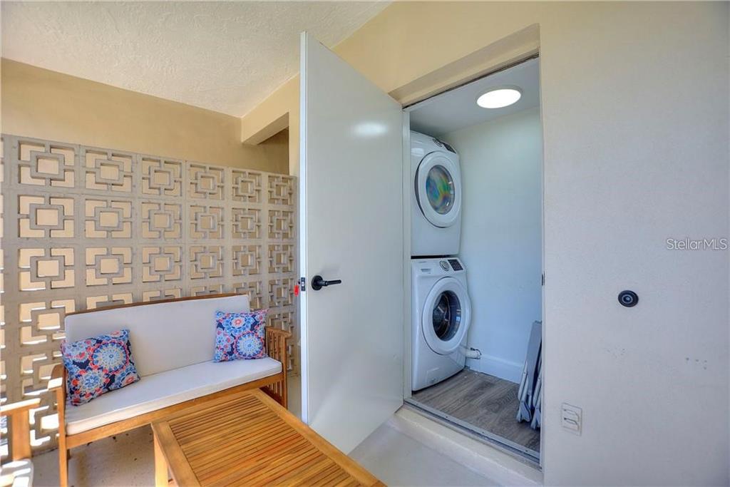 7003 Sunset Way, Unit 4 St. Pete Beach, FL 33706 - Photo 13 of 21 a bathroom with a sink and a mirror