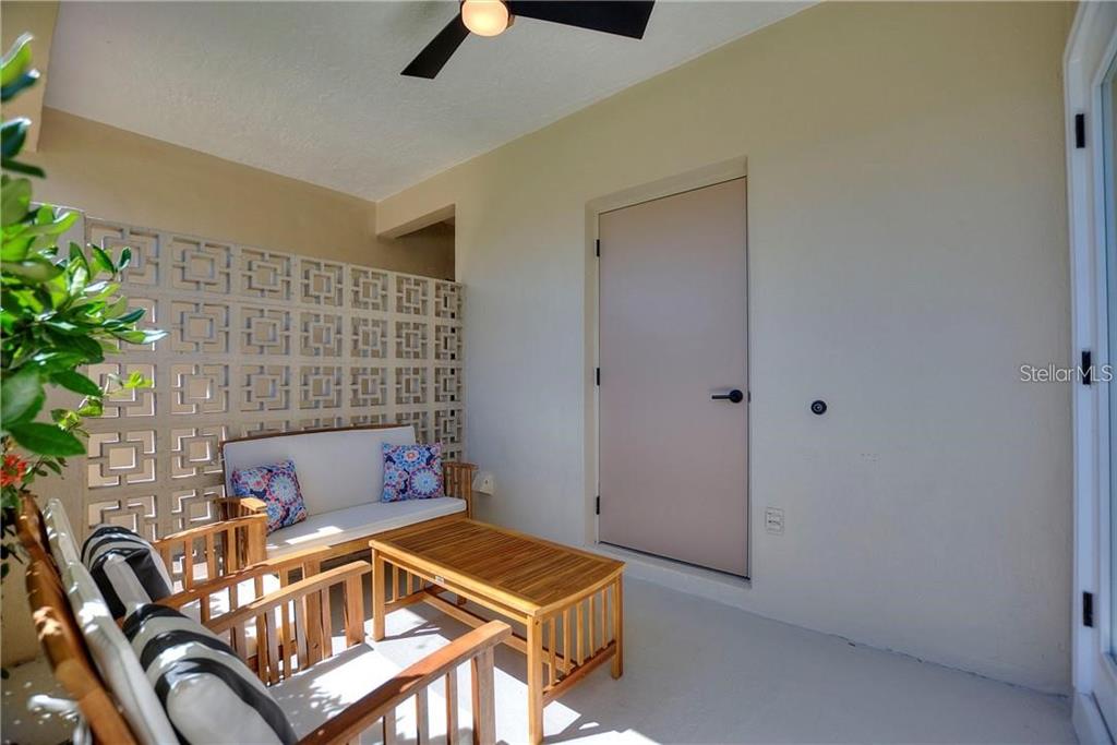 7003 Sunset Way, Unit 4 St. Pete Beach, FL 33706 - Photo 14 of 21 a living room with a couch