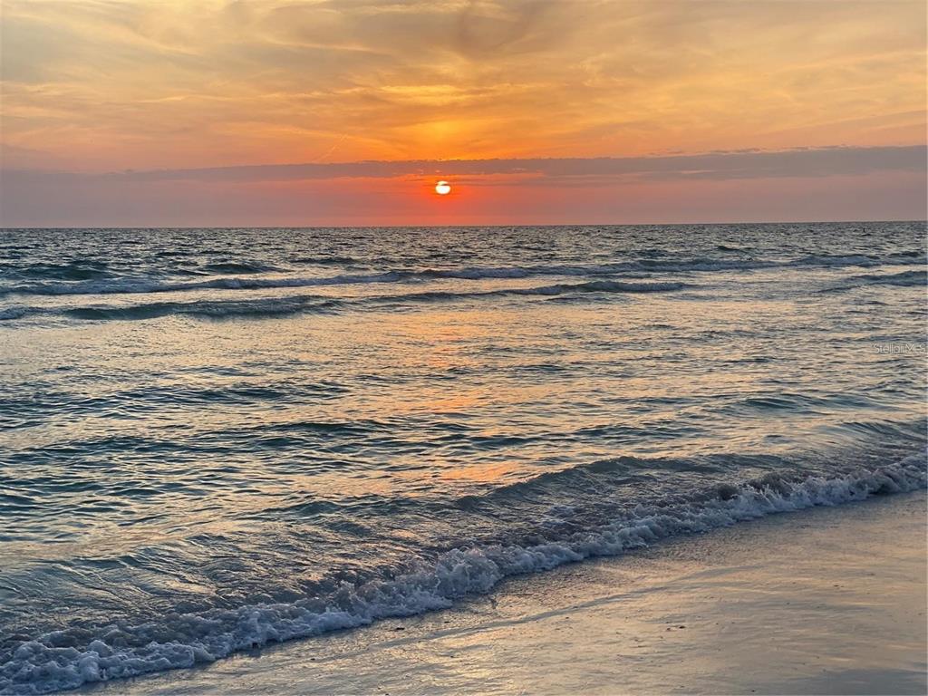 7003 Sunset Way, Unit 4 St. Pete Beach, FL 33706 - Photo 2 of 21 a view of an ocean and beach