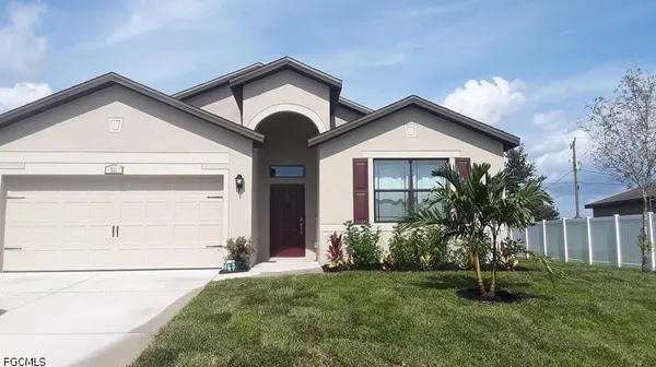 a front view of a house with a yard