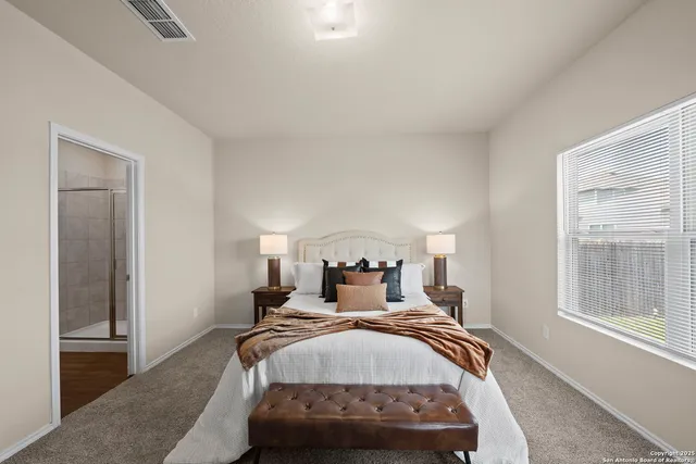 a bed room with a bed and a window