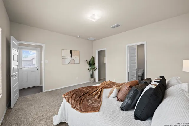 a bed room with a bed and a couch