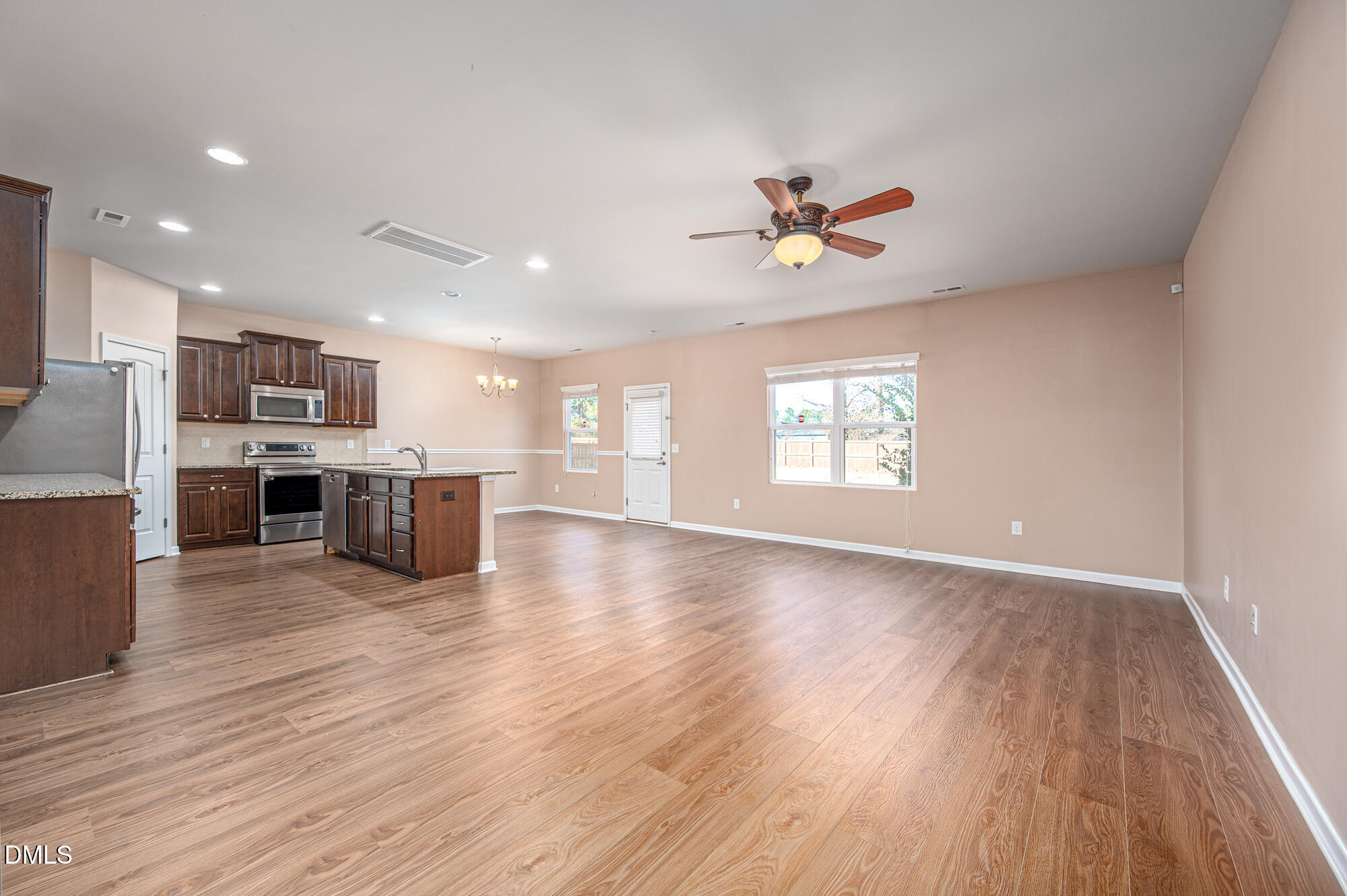 3548 Althorp Drive Raleigh, NC 27616 - Photo 10 of 56 a view of an empty room with kitchen and window
