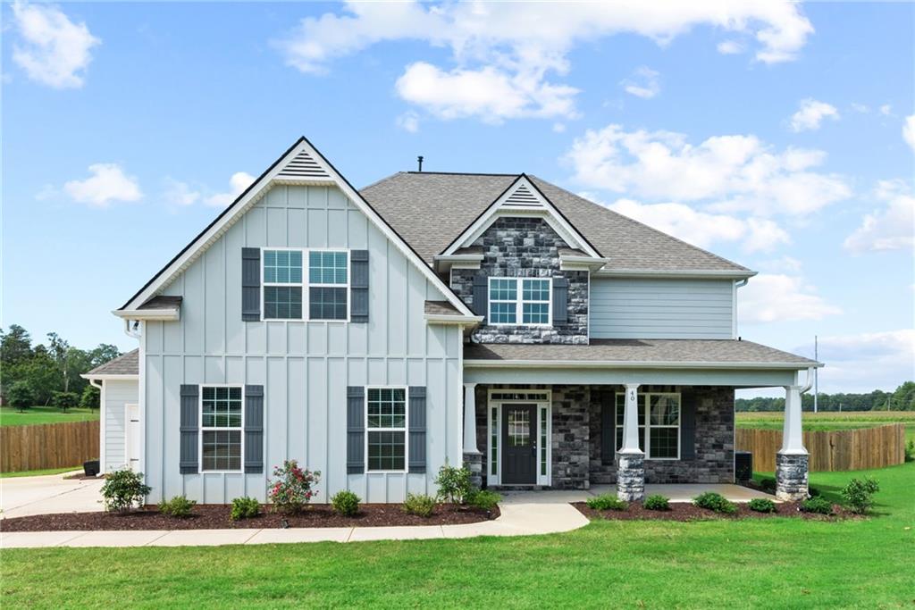 40 Owens Path Senoia, GA 30276 - Photo 1 of 1 a front view of a house with swimming pool and garden