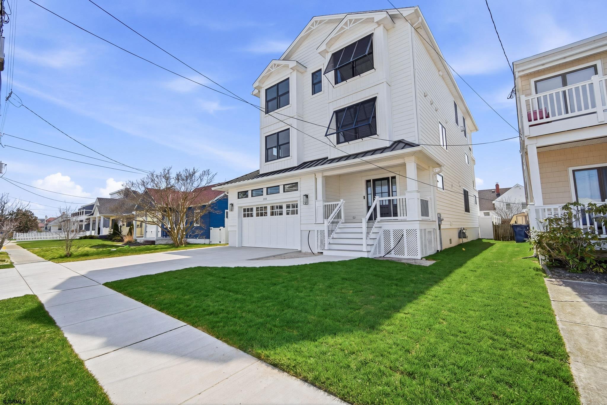 230 7th Street South Brigantine, NJ 08203 - Photo 2 of 87 a view of a house with a yard