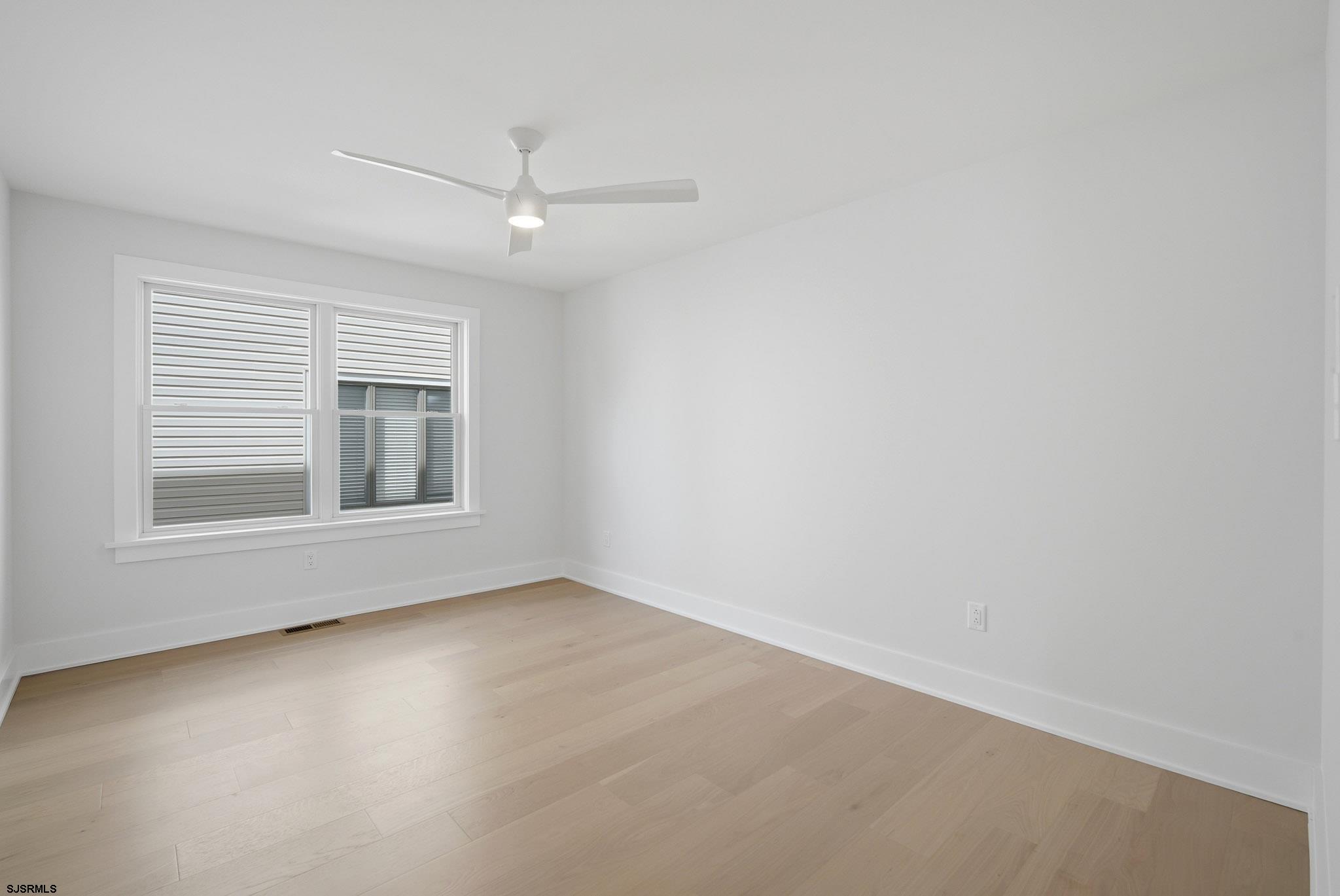 230 7th Street South Brigantine, NJ 08203 - Photo 21 of 87 a view of an empty room with a window