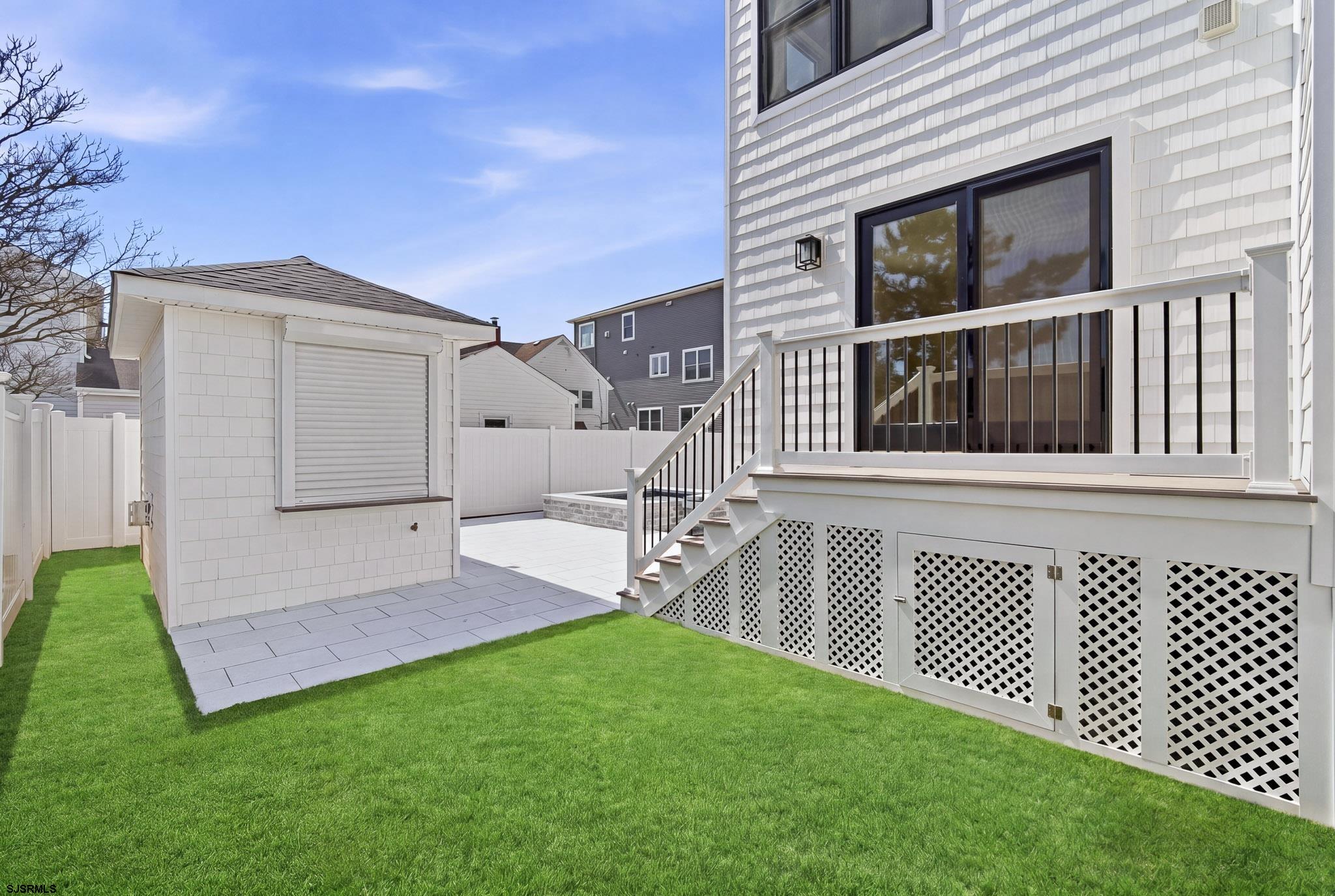 230 7th Street South Brigantine, NJ 08203 - Photo 3 of 87 a view of a house with a backyard