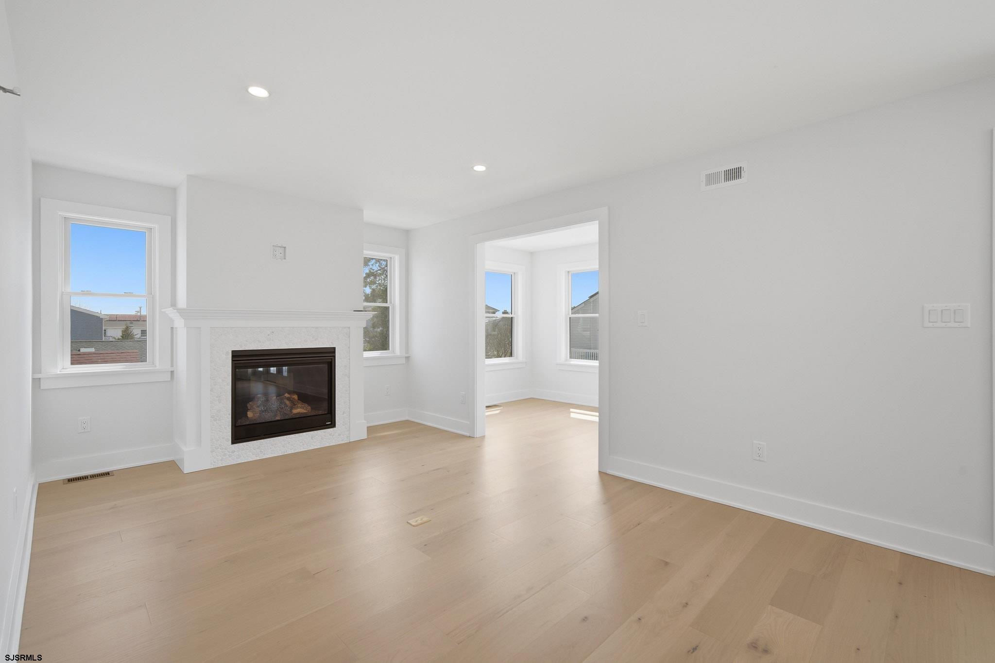 230 7th Street South Brigantine, NJ 08203 - Photo 31 of 87 a view of an empty room with a fireplace