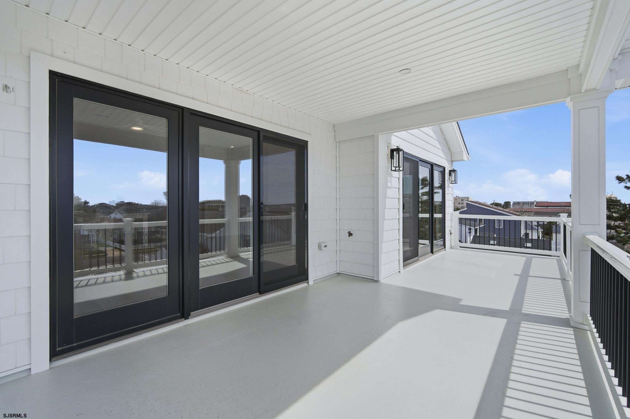 230 7th Street South Brigantine, NJ 08203 - Photo 57 of 87 a view of a living room hardwood floor and a large window