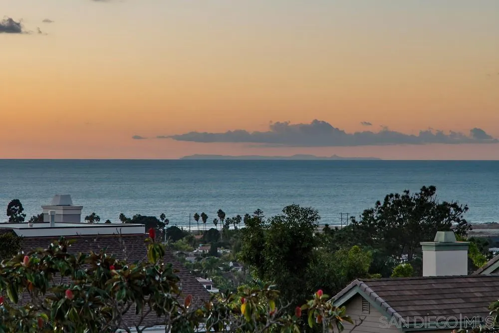1711 Burgundy Road Encinitas, CA 92024 - Photo 2 of 45 a view of a lake with sunset