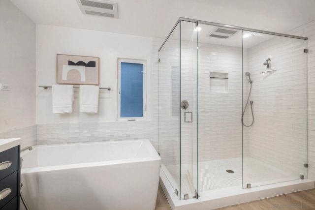 walk in closet with a mirror