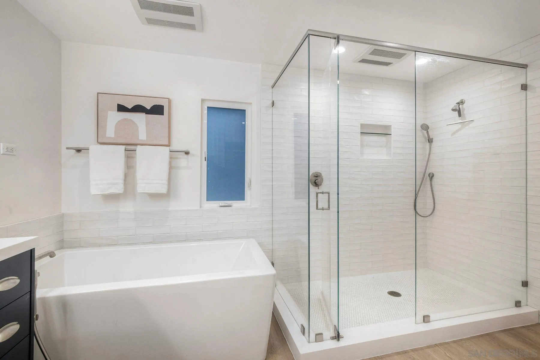 1711 Burgundy Road Encinitas, CA 92024 - Photo 22 of 45 a bathroom with a bathtub and a shower