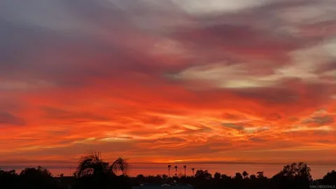a utility room with cabinets washer and dryer