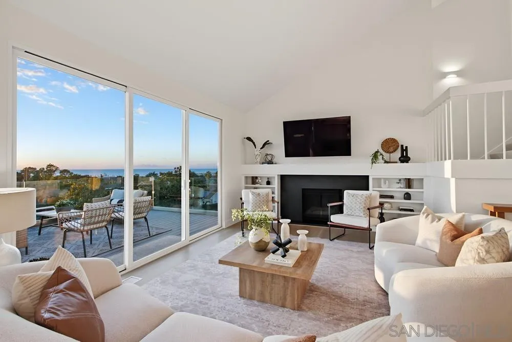 1711 Burgundy Road Encinitas, CA 92024 - Photo 6 of 45 a living room with furniture a fireplace and a flat screen tv