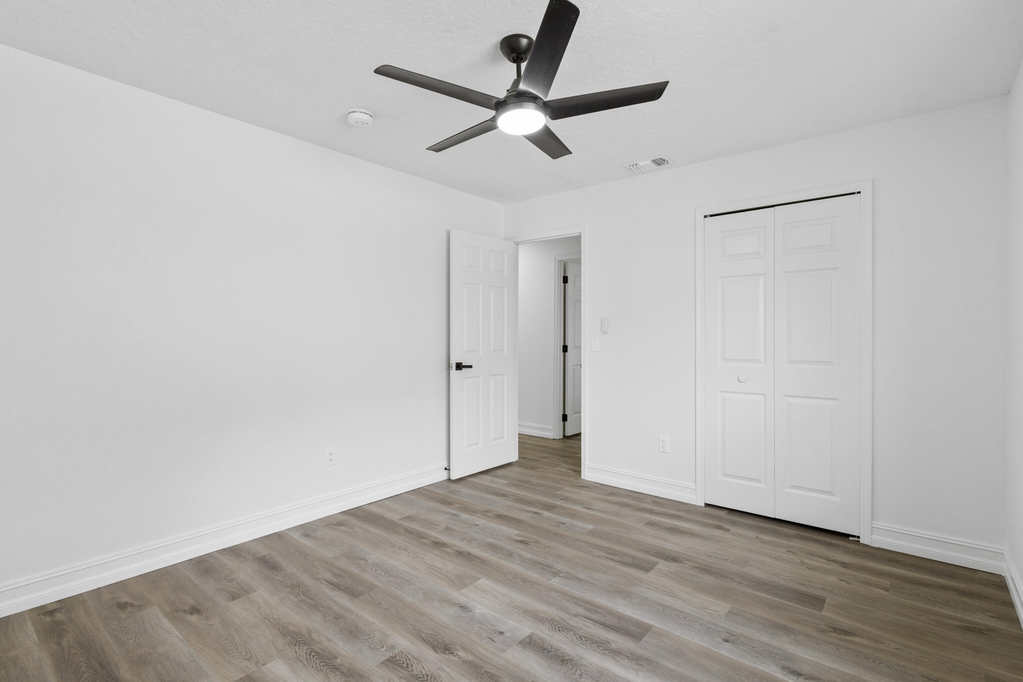 1695 Rustic Way Melbourne, FL 32935 - Photo 16 of 24 wooden floor in an empty room