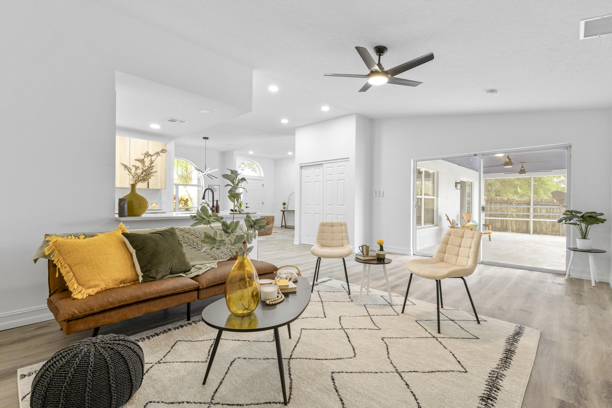 1695 Rustic Way Melbourne, FL 32935 - Photo 17 of 24 a living room with furniture and a ceiling fan