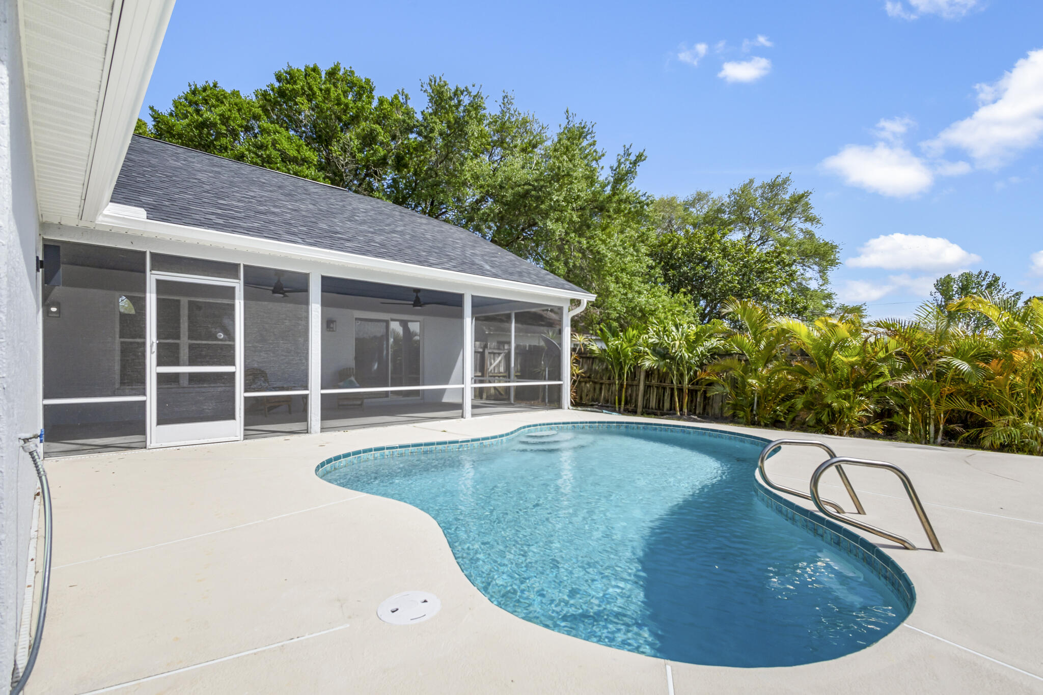 1695 Rustic Way Melbourne, FL 32935 - Photo 21 of 24 a view of a house with swimming pool and sitting area