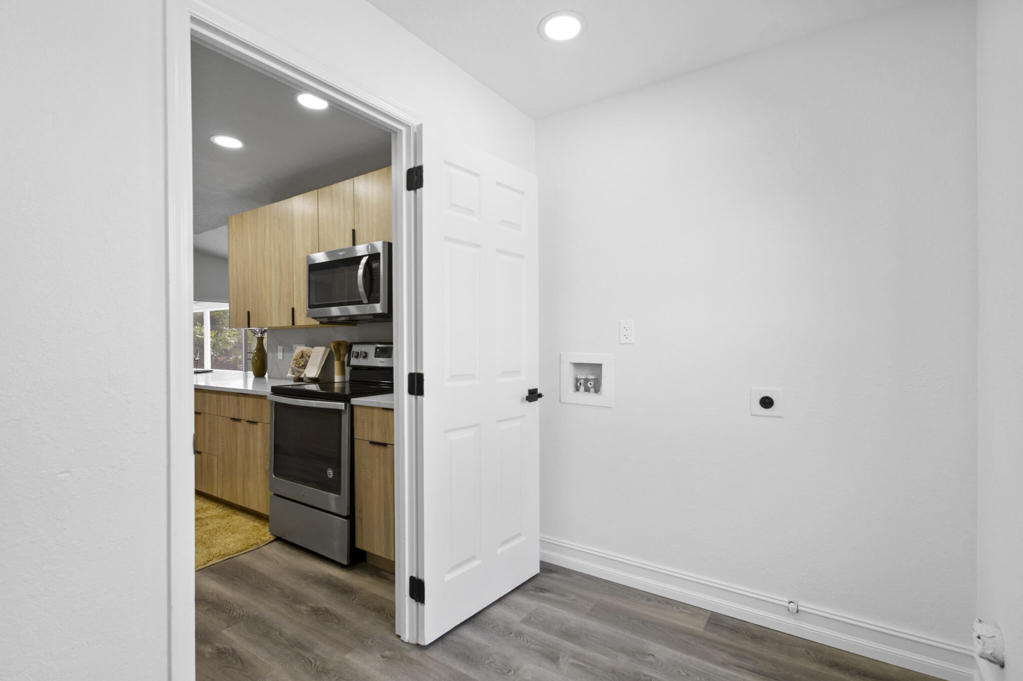 1695 Rustic Way Melbourne, FL 32935 - Photo 23 of 24 a kitchen with a refrigerator and a stove