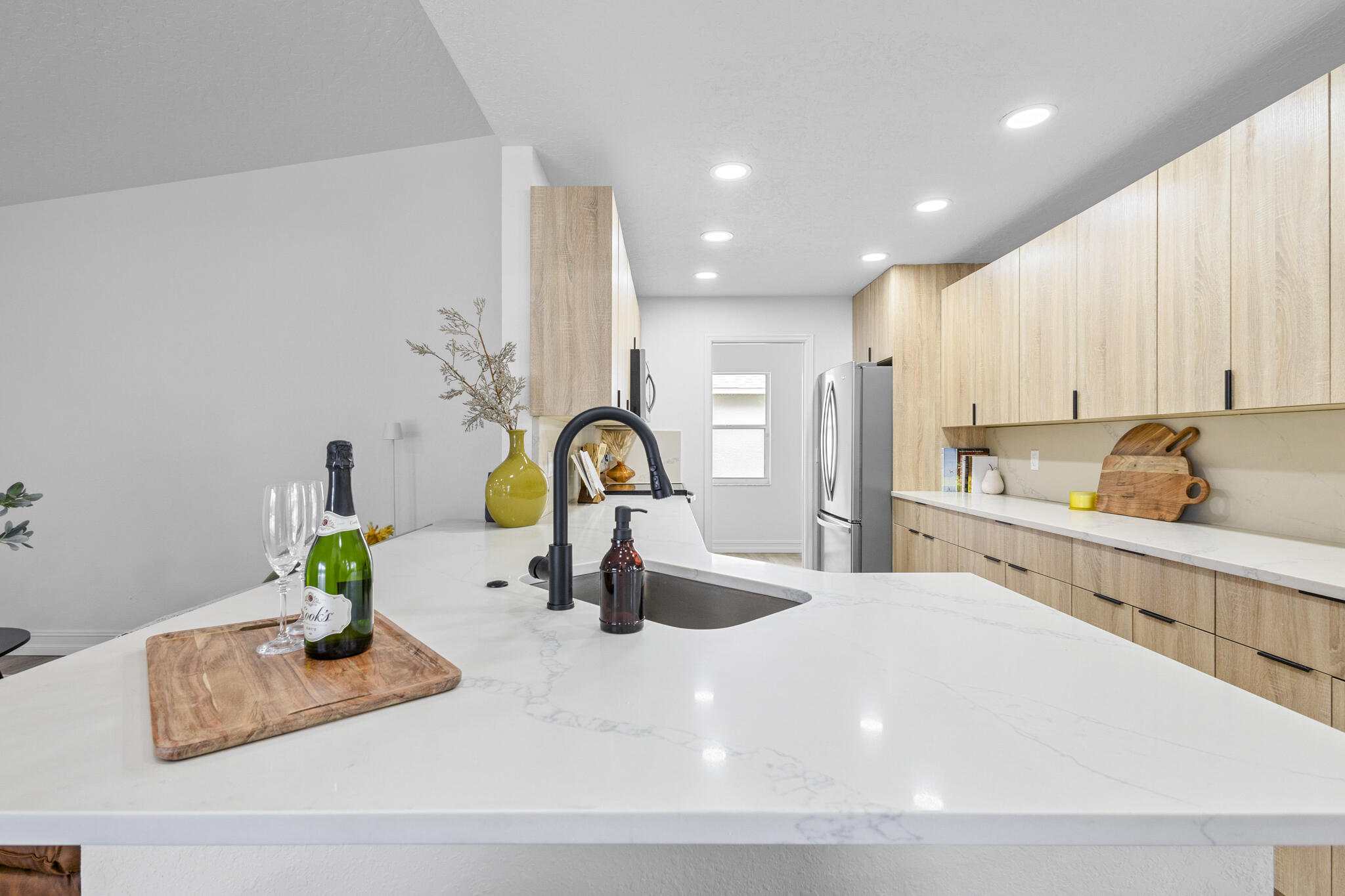 1695 Rustic Way Melbourne, FL 32935 - Photo 4 of 24 a kitchen with sink and white cabinets