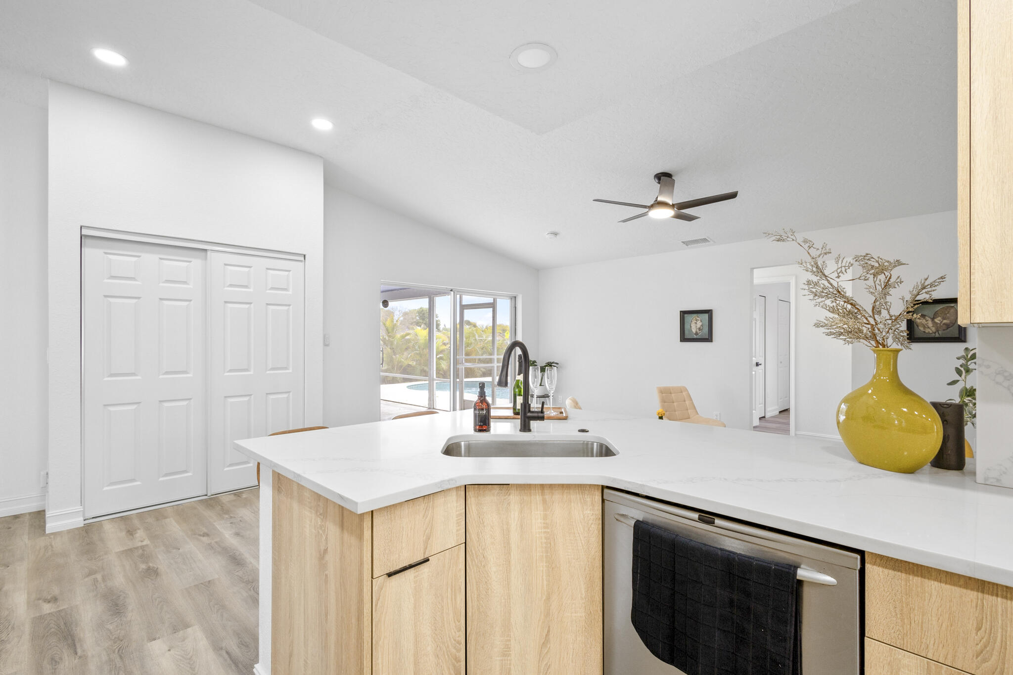 1695 Rustic Way Melbourne, FL 32935 - Photo 6 of 24 a kitchen with a sink appliances and cabinets